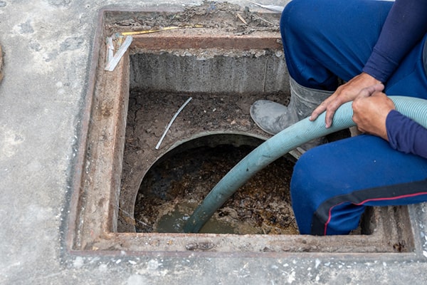 grease trap pumping involves removing the accumulated grease and food waste from the trap to prevent blockages and odors